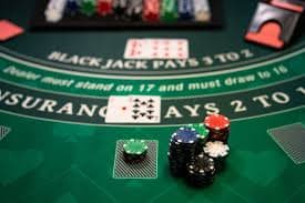 Live dealer studio with Egyptian-themed blackjack table setup and multi-camera broadcast equipment