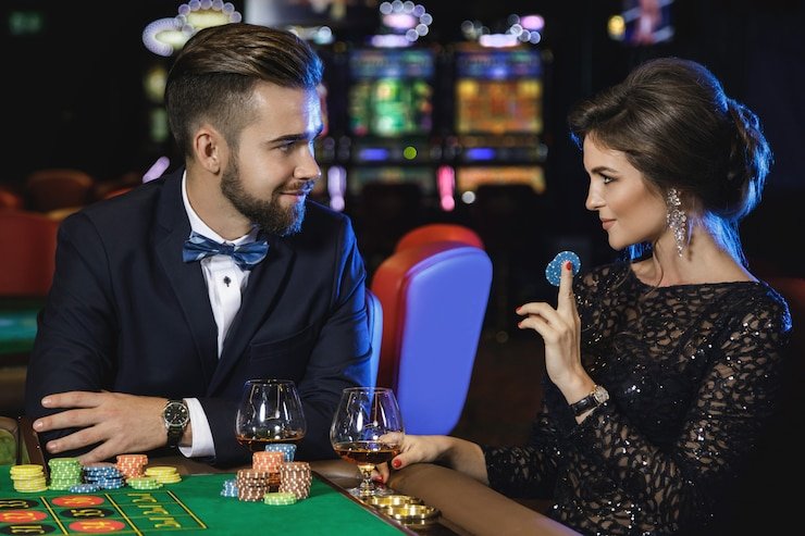 Mobile phone showing live blackjack table on enterslot app with dealer, betting interface, and chat Mobile phone showing live blackjack table on enterslot app with dealer, betting interface, and chat